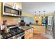 Modern kitchen with stainless steel appliances, island with breakfast bar, and open layout for entertaining at 3515 Luna Ln, Durham, NC 27705