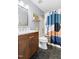 Well-lit bathroom with modern vanity, stylish mirror, and hexagon tile flooring at 3634 Ranbir Dr, Durham, NC 27713