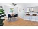 Bright dining area with a round table, stylish chairs, and hardwood floors at 3634 Ranbir Dr, Durham, NC 27713