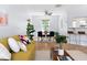 Open living space with dining table and bar seating, filled with natural light at 3634 Ranbir Dr, Durham, NC 27713