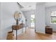 Bright foyer with hardwood floors, stylish console table, and a welcoming atmosphere at 3634 Ranbir Dr, Durham, NC 27713