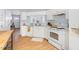 Bright eat-in kitchen with white appliances and cabinets, and plenty of counter space at 3634 Ranbir Dr, Durham, NC 27713