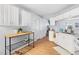 Functional kitchen with white cabinets and eat-in area at 3634 Ranbir Dr, Durham, NC 27713