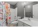 Bathroom featuring a shower with curtain, large mirror, and vanity with storage at 3803 Ridgewood Dr, Franklinton, NC 27525