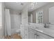 Bright bathroom with double vanity, tub/shower, and neutral decor at 3803 Ridgewood Dr, Franklinton, NC 27525