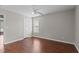 Spacious bedroom with wood floors, ceiling fan, and natural light from the window at 3803 Ridgewood Dr, Franklinton, NC 27525