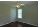 A bright bedroom featuring hardwood floors, a ceiling fan and a window offering ample natural light at 3803 Ridgewood Dr, Franklinton, NC 27525