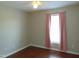 This bedroom has hard wood floors, a ceiling fan, pink curtains, and a double door closet at 3803 Ridgewood Dr, Franklinton, NC 27525