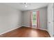 Bright bedroom with hardwood flooring, window, and ceiling fan at 3803 Ridgewood Dr, Franklinton, NC 27525