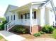 Charming home featuring a lovely covered front porch with white railings and brick accents at 3803 Ridgewood Dr, Franklinton, NC 27525