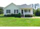 Charming one-story home with a well-manicured lawn and inviting front porch at 3803 Ridgewood Dr, Franklinton, NC 27525