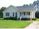 Inviting one-story home featuring a cozy front porch and a well-maintained yard at 3803 Ridgewood Dr, Franklinton, NC 27525