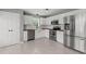 Modern kitchen with white cabinets, stainless steel appliances, and butcher block countertops at 3803 Ridgewood Dr, Franklinton, NC 27525