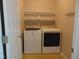 Convenient laundry room with washer, dryer, and shelving for storage at 3803 Ridgewood Dr, Franklinton, NC 27525