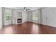 Bright living room with hardwood floors, a fireplace, and lots of natural light at 3803 Ridgewood Dr, Franklinton, NC 27525