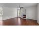 Spacious living room with hardwood floors and a charming fireplace at 3803 Ridgewood Dr, Franklinton, NC 27525