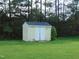 Outdoor storage shed provides extra space for tools and equipment, surrounded by green lawn at 3803 Ridgewood Dr, Franklinton, NC 27525