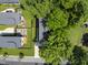 Charming home with lush backyard, including a stone pathway and beautiful mature trees at 409 E Lee St, Raleigh, NC 27601