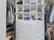 Organized walk-in closet with custom shelving, drawers, and ample storage space at 409 E Lee St, Raleigh, NC 27601