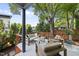 Outdoor deck features comfortable seating, modern railings, and plenty of shade from the mature trees at 409 E Lee St, Raleigh, NC 27601