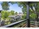 Deck view overlooking neighborhood homes and trees, with skyline visible in distance at 409 E Lee St, Raleigh, NC 27601