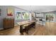 Bright dining area features modern lighting, hardwood floors, and large window overlooking the neighborhood at 409 E Lee St, Raleigh, NC 27601