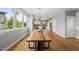 Bright dining area featuring hardwood floors, modern light fixture, and ample natural light at 409 E Lee St, Raleigh, NC 27601