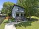 Charming two-story home features a modern design, landscaped yard, and inviting front porch at 409 E Lee St, Raleigh, NC 27601
