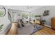 Inviting living room featuring hardwood floors, a comfortable sofa, and natural light at 409 E Lee St, Raleigh, NC 27601