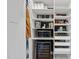 Organized pantry with shelving, drawers, and a wine cooler for convenient storage at 409 E Lee St, Raleigh, NC 27601