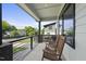 Covered front porch with wooden rocking chairs, offering a relaxing outdoor space at 409 E Lee St, Raleigh, NC 27601