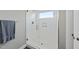 Modern shower with clear glass door, white subway tile, and a built-in shelf at 409 E Lee St, Raleigh, NC 27601