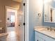 Bathroom featuring a vanity, a mirror, and an open door that allows you to see another room at 4104 Bankshire Ln, Raleigh, NC 27603