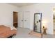 Bright bedroom with a large mirror, soft rug, and ensuite bath access at 4104 Bankshire Ln, Raleigh, NC 27603