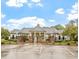 Elegant clubhouse featuring stone accents, manicured landscaping, and accessible parking at 4104 Bankshire Ln, Raleigh, NC 27603