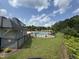 Community pool area featuring multiple pools, pergola covered seating, and a black safety fence at 4104 Bankshire Ln, Raleigh, NC 27603