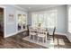 Dining room with natural light, a table with seating, and access to the outdoors at 4104 Bankshire Ln, Raleigh, NC 27603