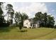 Well-maintained two-story home with a manicured lawn and lush landscaping at 4104 Bankshire Ln, Raleigh, NC 27603