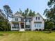 Stunning new construction, two-story home with white siding, black shutters, and a well-manicured lawn at 4104 Bankshire Ln, Raleigh, NC 27603
