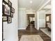 Welcoming foyer with hardwood floors, elegant decor, and seamless flow into the living spaces at 4104 Bankshire Ln, Raleigh, NC 27603