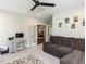 Living room featuring a desk, a sectional sofa, and french doors that lead to other rooms at 4104 Bankshire Ln, Raleigh, NC 27603