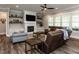 Cozy living room featuring a fireplace, built-in shelves, hardwood floors and lots of natural light at 4104 Bankshire Ln, Raleigh, NC 27603