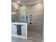 Luxurious walk-in shower with multiple shower heads, herringbone tile, and niche at 4104 Bankshire Ln, Raleigh, NC 27603