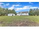 Home's backyard featuring a shed and spacious grassy area at 430 Sir David Dr, Zebulon, NC 27597