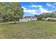 Spacious backyard with green grass and a shed at 430 Sir David Dr, Zebulon, NC 27597