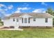 Inviting backyard with a well-maintained white house and a charming, accessible entrance at 430 Sir David Dr, Zebulon, NC 27597