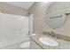 Charming bathroom with tiled walls, a granite countertop sink, and a shower featuring tiled walls at 430 Sir David Dr, Zebulon, NC 27597