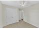 Well-lit bedroom with closet and tile flooring at 430 Sir David Dr, Zebulon, NC 27597