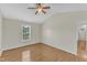 Comfortable bedroom features hardwood floors, vaulted ceiling with fan, and a bright window with outdoor views at 430 Sir David Dr, Zebulon, NC 27597