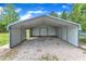 Metal carport with gravel flooring and ample space at 430 Sir David Dr, Zebulon, NC 27597